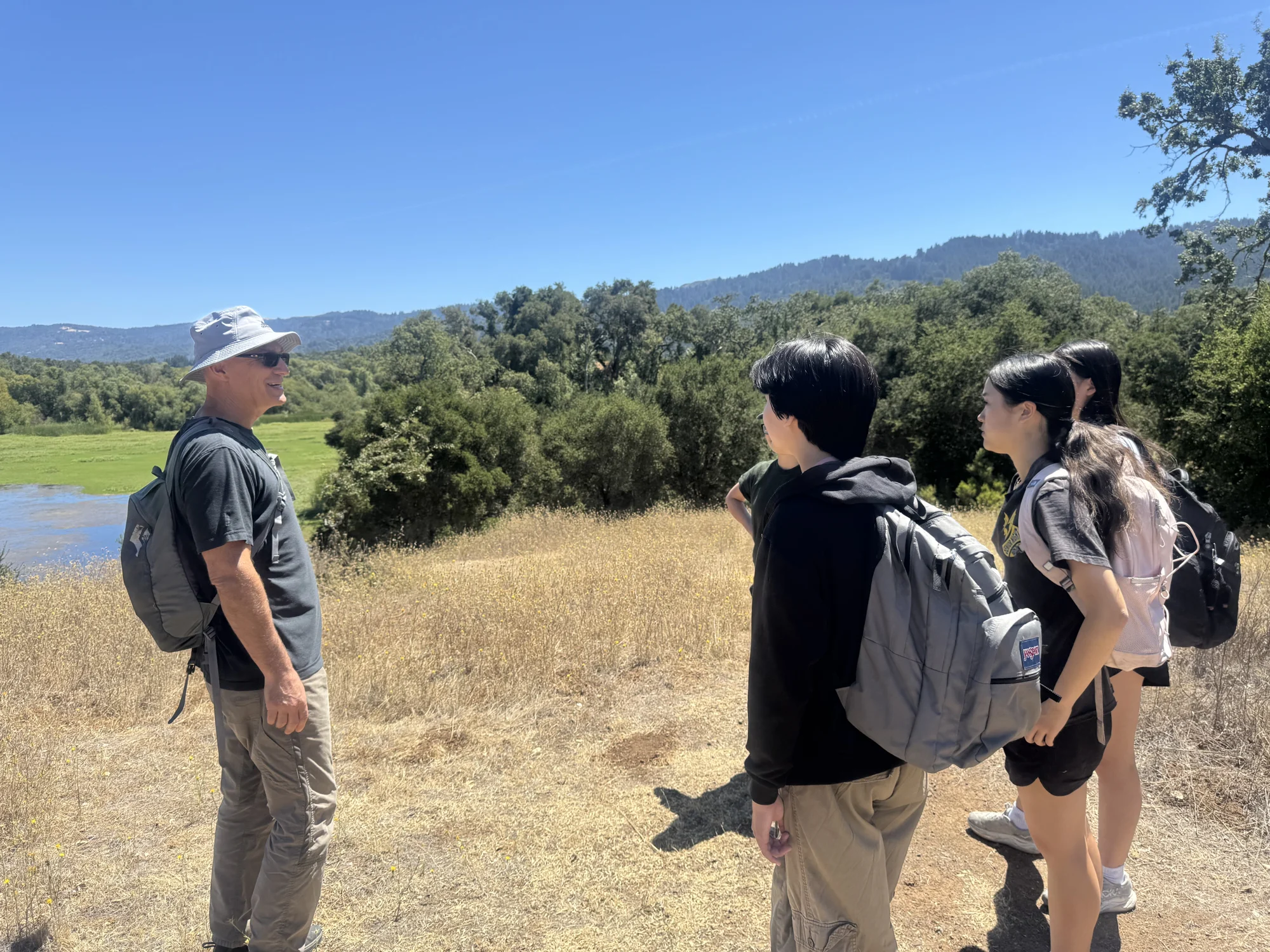 G-SIL students discussing the landscape during a field learning visit