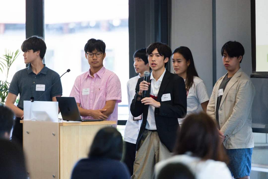 A student team presenting its project to an audience